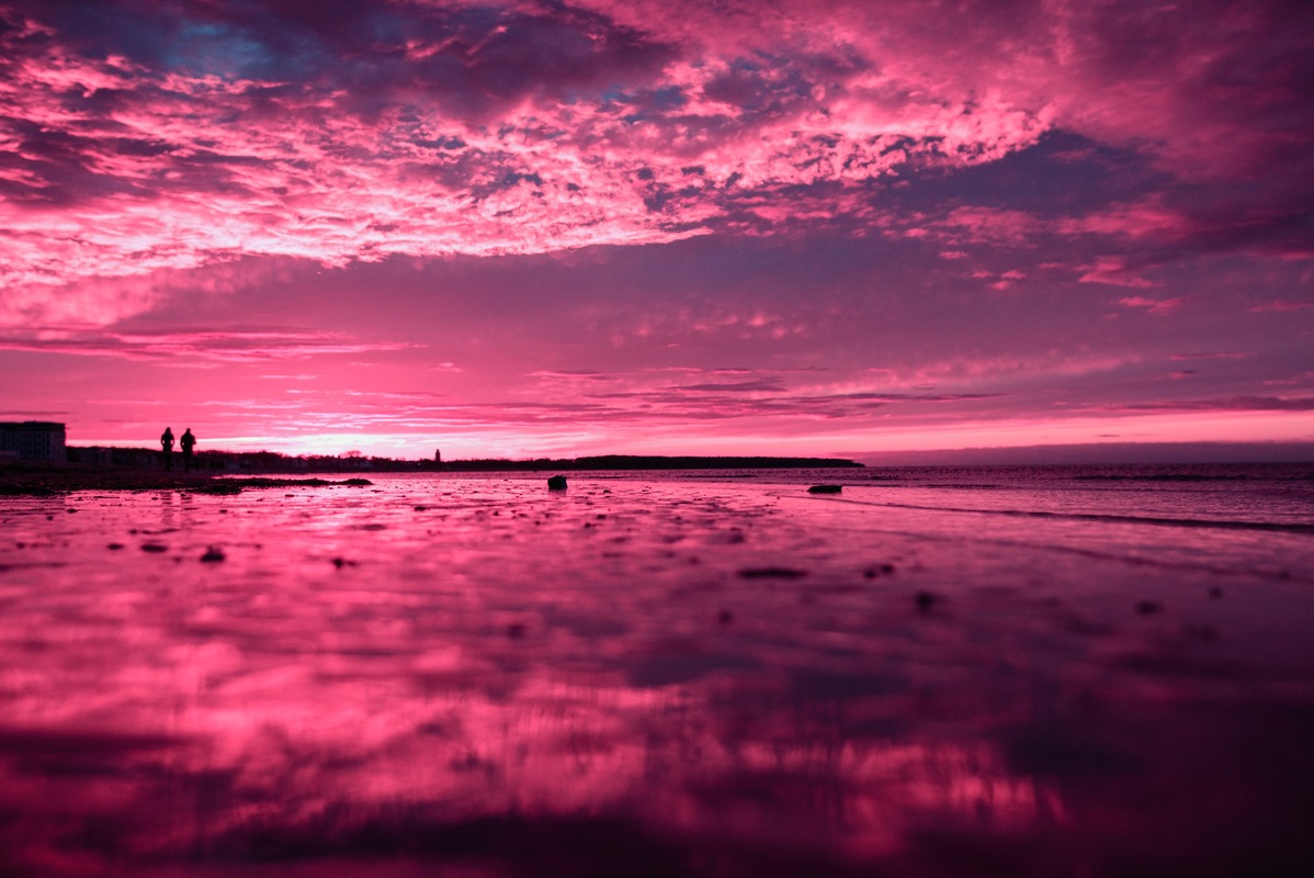 PINK color psychology: Scenic view of beach against dramatic sky